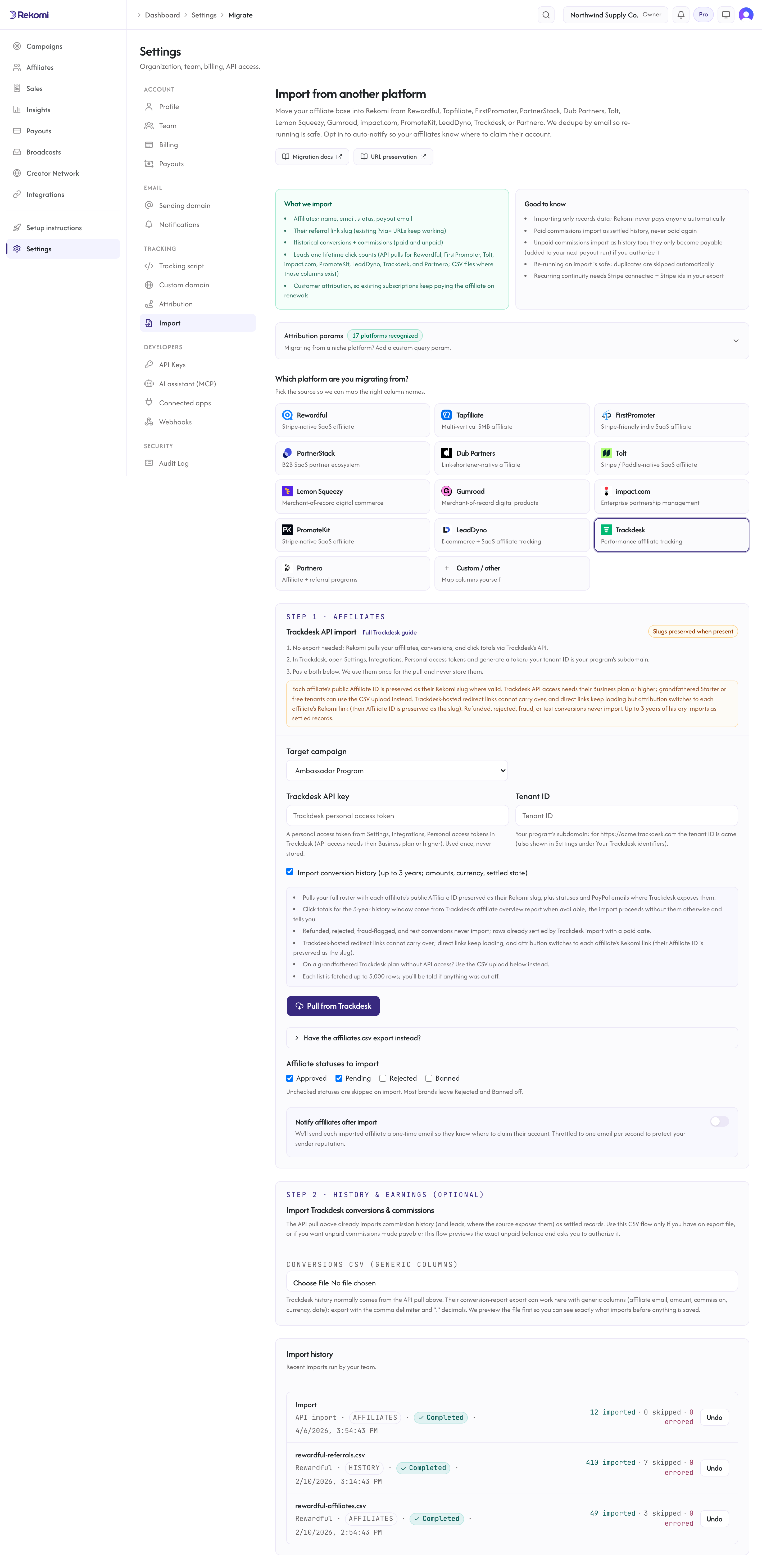 The Trackdesk import step in Rekomi with the personal access token and tenant ID fields, the history toggle, and the Pull from Trackdesk button