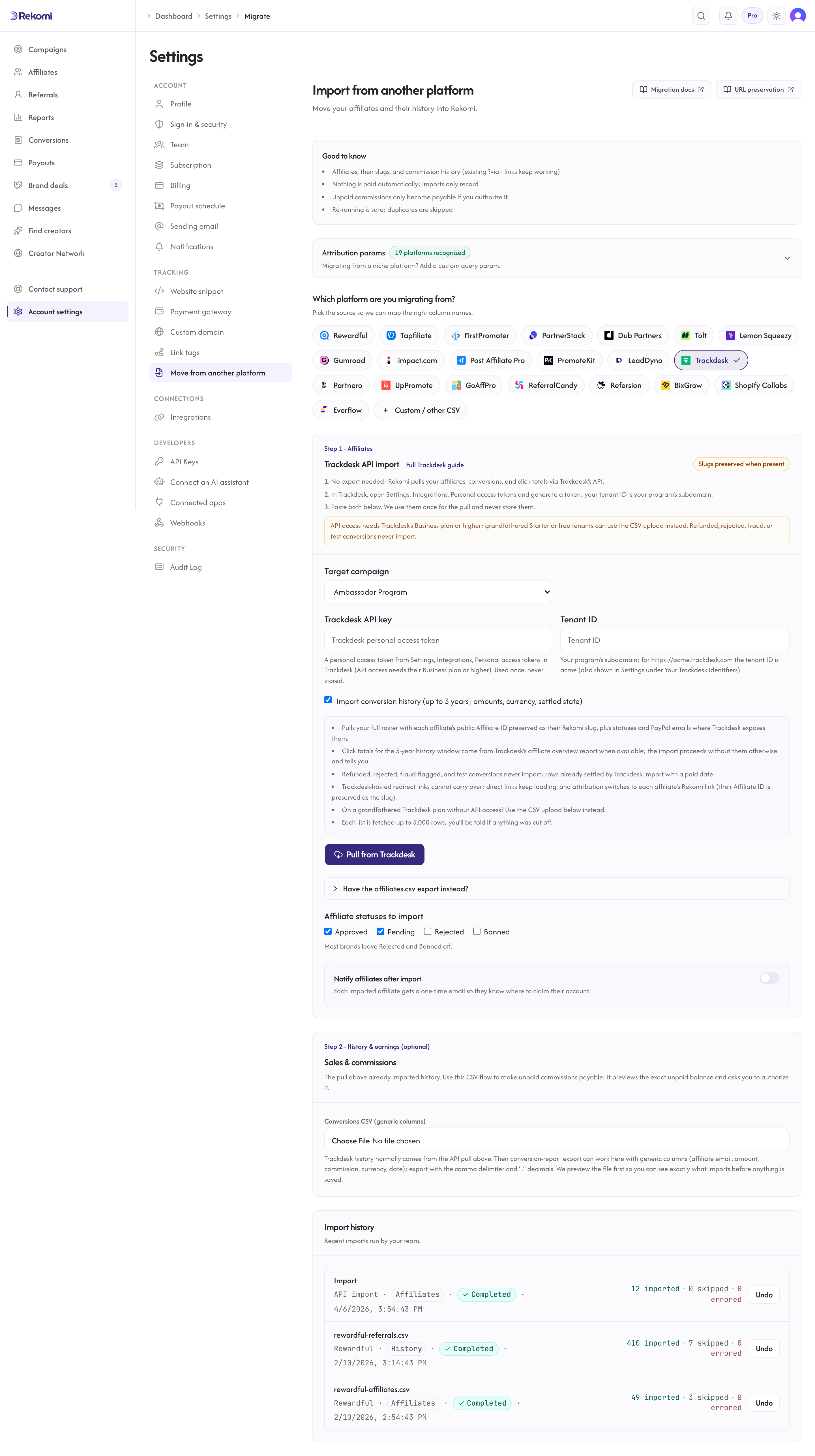 The Trackdesk import step in Rekomi with the personal access token and tenant ID fields, the history toggle, and the Pull from Trackdesk button